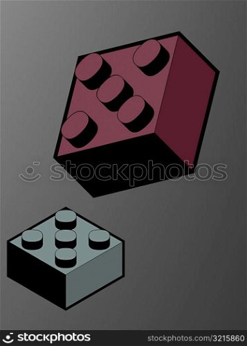Close-up of two plastic blocks against a gray background