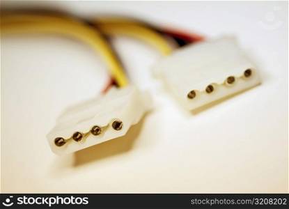 Close-up of two power cables