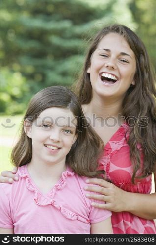 Close-up of two sisters smiling