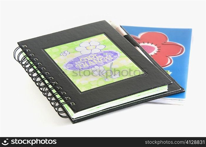 Close-up of two spiral notebooks