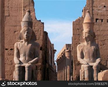 Close-up of two statues in a temple, Temple Of Luxor, Luxor, Egypt