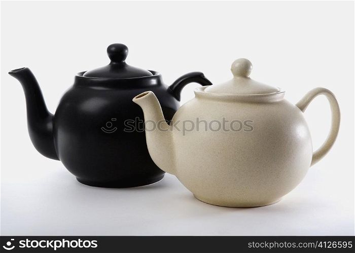 Close-up of two tea kettles