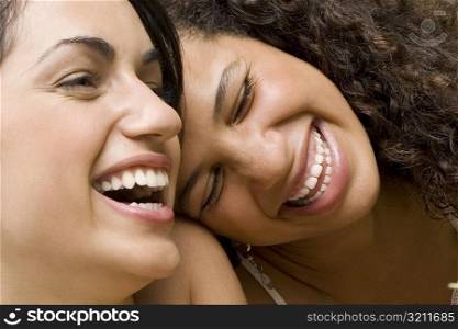 Close-up of two university students laughing
