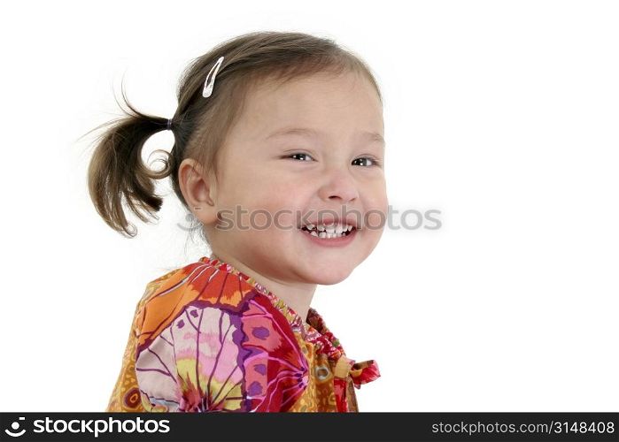 Close-up of two year old Japanese American toddler girl laughing.