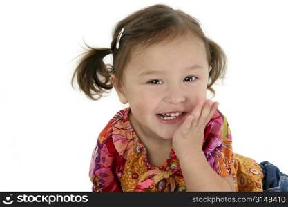 Close-up of two year old Japanese American toddler girl laughing.