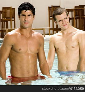Close-up of two young men in a swimming pool