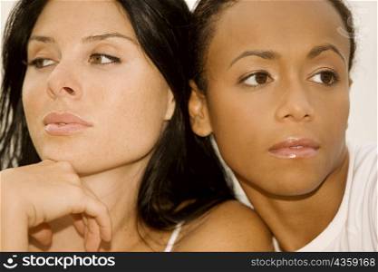 Close-up of two young women looking away