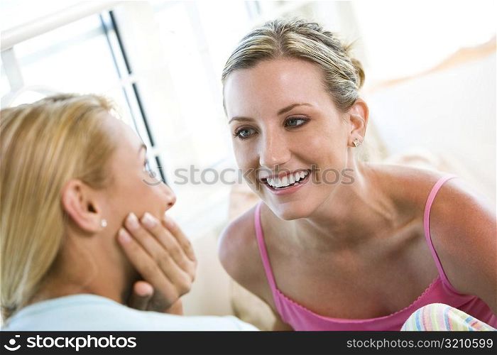 Close-up of two young women talking