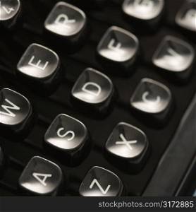 Close up of type levers on typewriter keyboard.