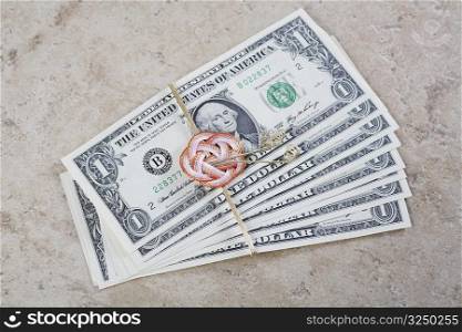 Close-up of US paper currency tied with a ribbon