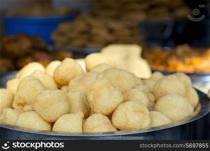 Close-up of vadas in container