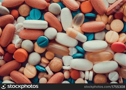 Close up of variety of colorful pills, capsules, and tablets
