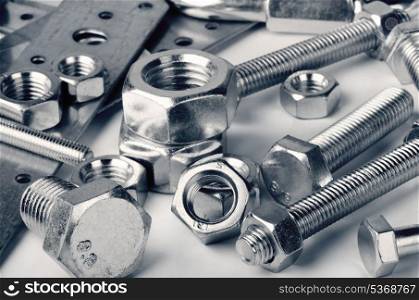 Close-up of various steel nuts and bolts