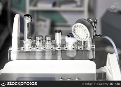 Close-up of various tools of medical cosmetology apparatus for liposuction and massage, used for the correction of the human body. Machine cosmetology.. A set of medical instruments for cosmetology apparatus for liposuction and massage, for the correction of the body. Machine cosmetology.