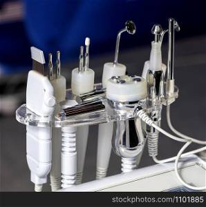 Close-up of various tools of medical cosmetology apparatus for liposuction and massage, used for the correction of the human body. Machine cosmetology.. A set of medical instruments for cosmetology apparatus for liposuction and massage, for the correction of the body. Machine cosmetology.