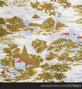 Close-up of vintage fabric with village and trees printed on polyester.