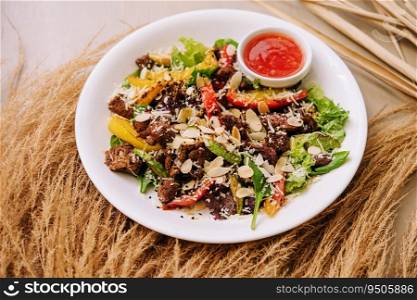 Close up of warm salad with beef and vegetables