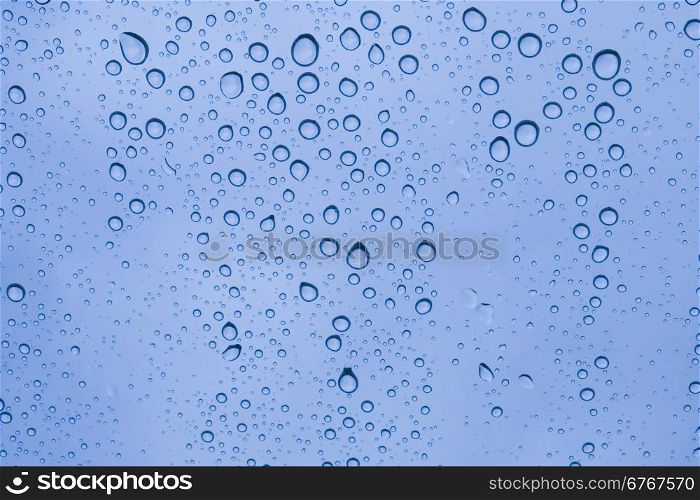 Close-up of water drops on glass surface