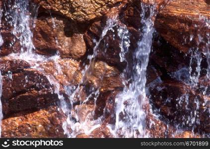 Close-up of water flowing down a rock formation