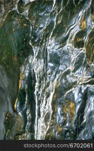 Close-up of water flowing down a rock surface