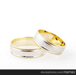Close-Up Of Wedding Rings Against White Background