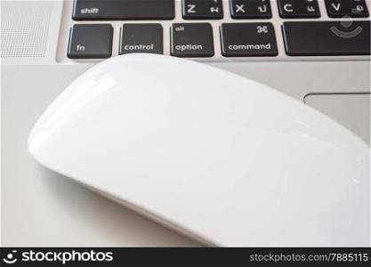Close up of white labtop with mouse, stock photo