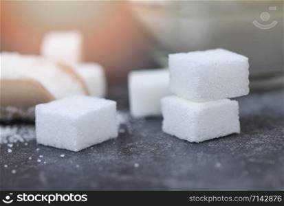 Close up of white sugar / Sugar cubes on table background selective focus