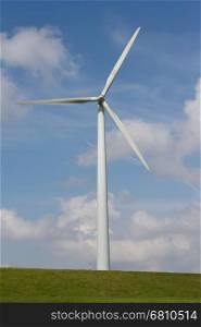 Close up of Wind turbine producing alternative energy on a dutch dike