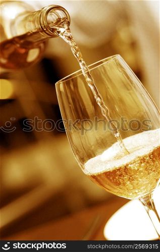 Close-up of wine being poured into a wineglass