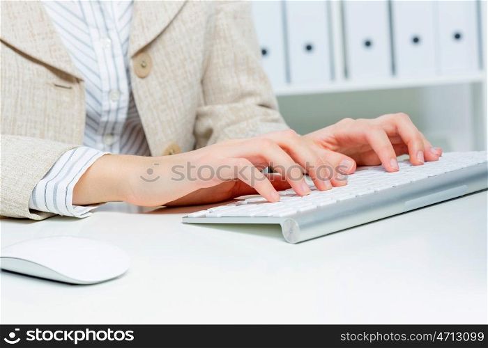 Close up of woman&#39;s hands working in office on computer