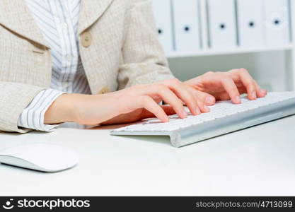 Close up of woman&#39;s hands working in office on computer