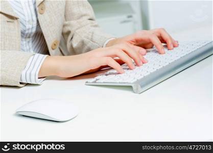 Close up of woman&#39;s hands working in office on computer