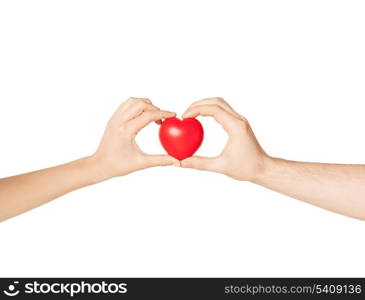 close up of woman and man hands with heart