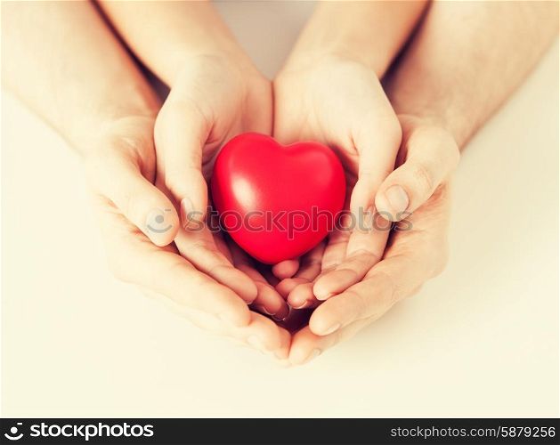 close up of woman and man hands with heart. woman and man hands with heart