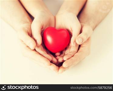 close up of woman and man hands with heart. woman and man hands with heart