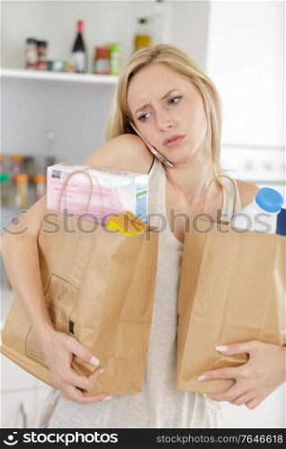 close up of woman customer with paper shopping bags