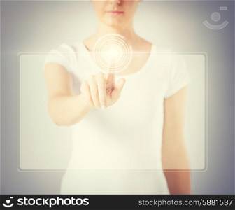close up of woman hand touching virtual screen