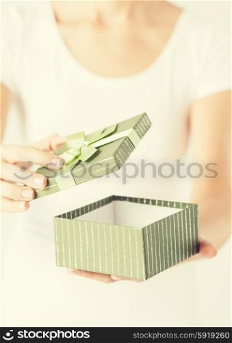 close up of woman hands opening gift box.. woman hands with gift box