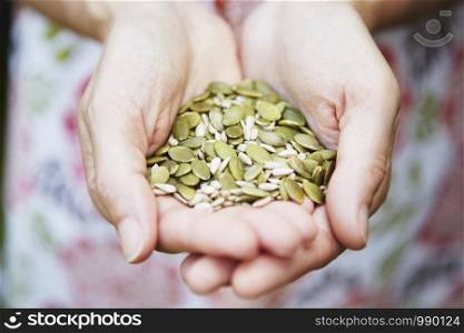 Close Up Of Woman Holding Sunflower Seeds
