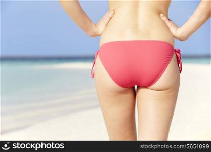 Close Up Of Woman In Bikini Walking On Tropical Beach