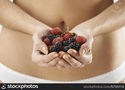 Close Up Of Woman In Underwear Holding Fresh Summer Berries