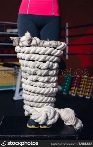 Close up of woman legs bound with rope. Woman with legs bound