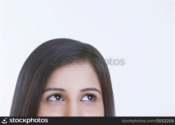 Close-up of woman looking up