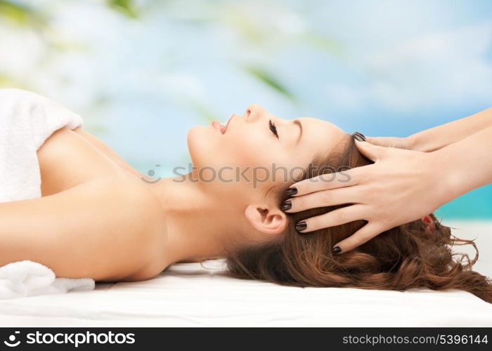 close up of woman on resort getting head spa treatment
