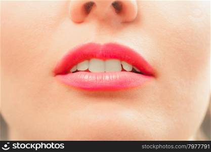 Close up of woman pink lips.. Close up of woman girl pink lips mouth. Make up.