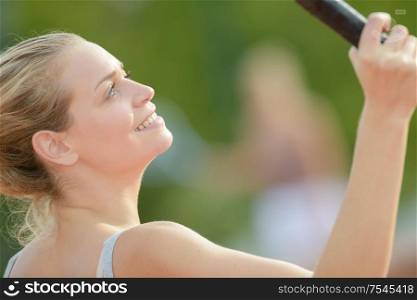 close up of woman playing tennis