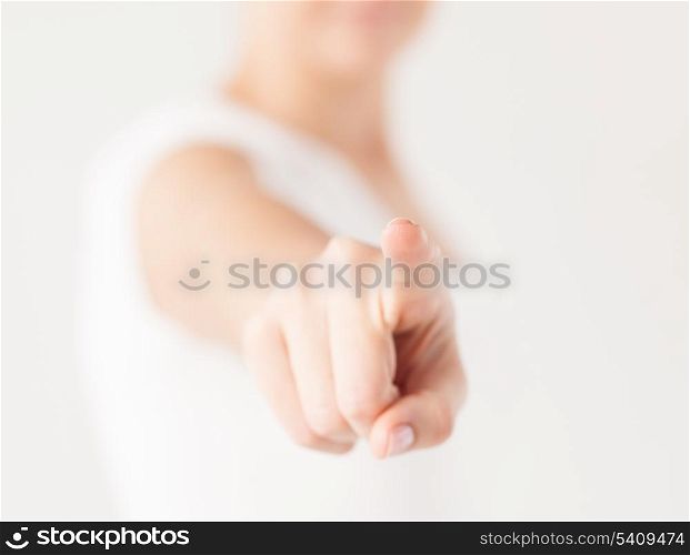 close up of woman pointing her finger at you