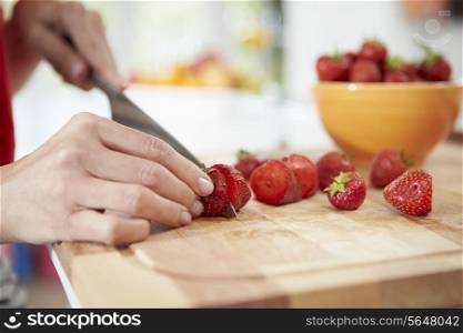Close Up Of Woman Preparing Fruit Salad