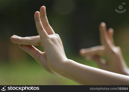 Close-up of woman's hands in yoga gesture