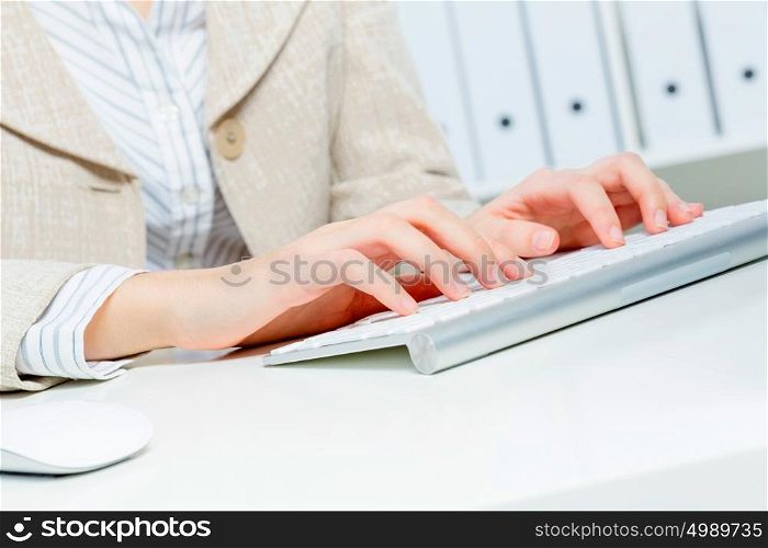 Close up of woman&rsquo;s hands working in office on computer